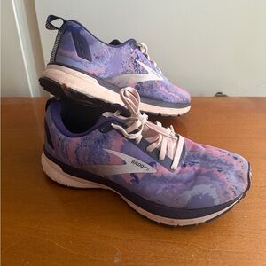 Women's Brooks Revel 4 running shoes in a purple, black, and orchid tie-dye